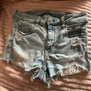 American Eagle light wash denim short with crocheted pocket accents size US4
